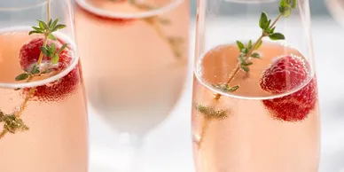 Pink champagne with raspberries at the wedding venue near Corsicana Texas.