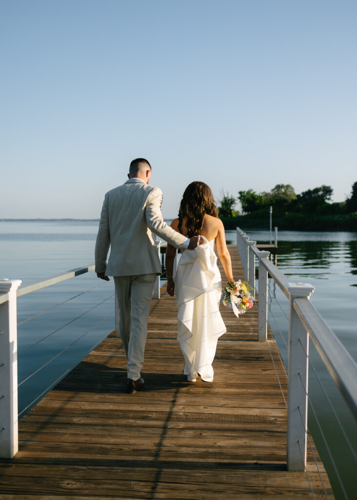 Bride & groom on the pier of their Dallas wedding venue.