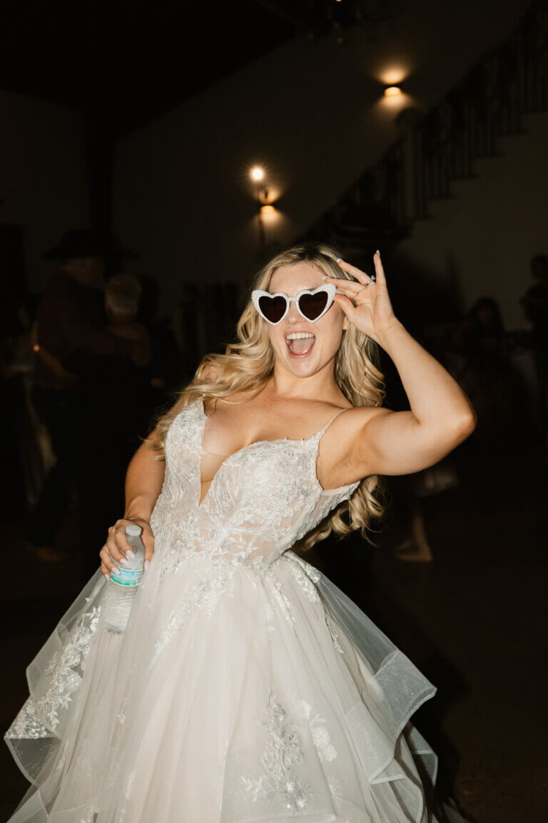 Bride with viral sunglasses at a wedding venue near me.