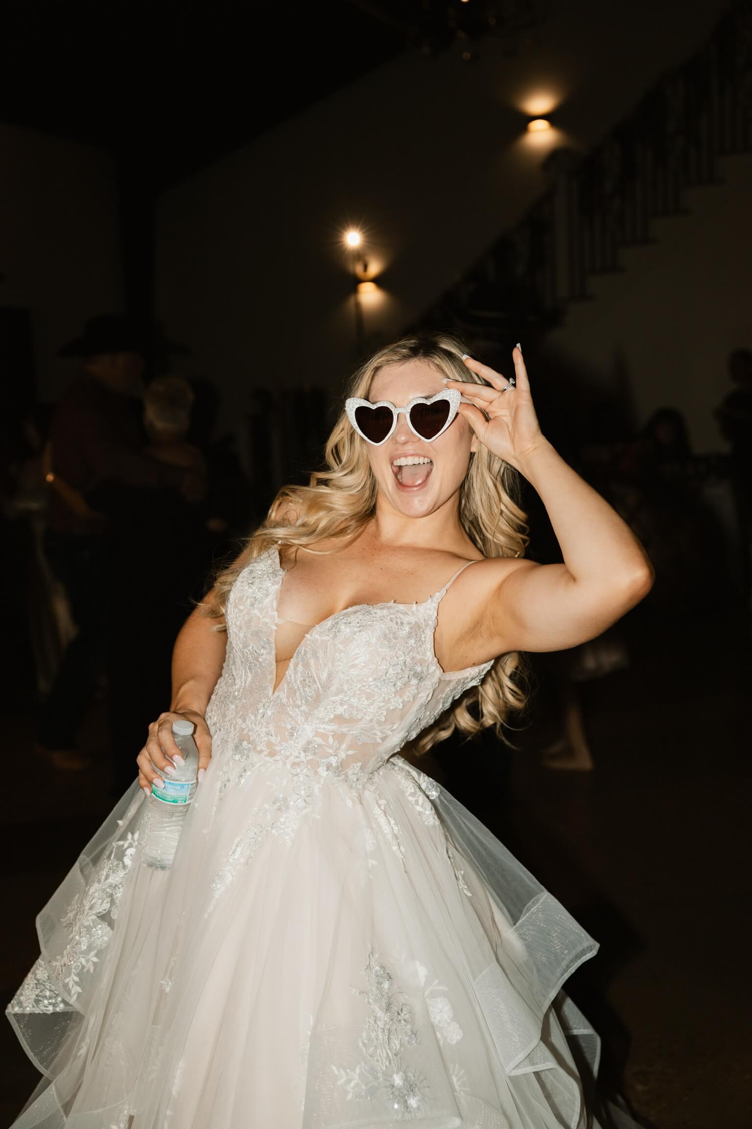 Bride with viral sunglasses at a wedding venue near me.