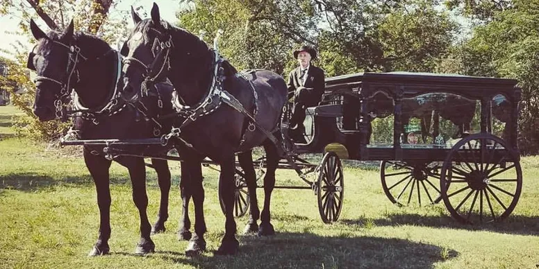 Horse drawn hearse for Halloween wedding at Corsicana wedding venue.