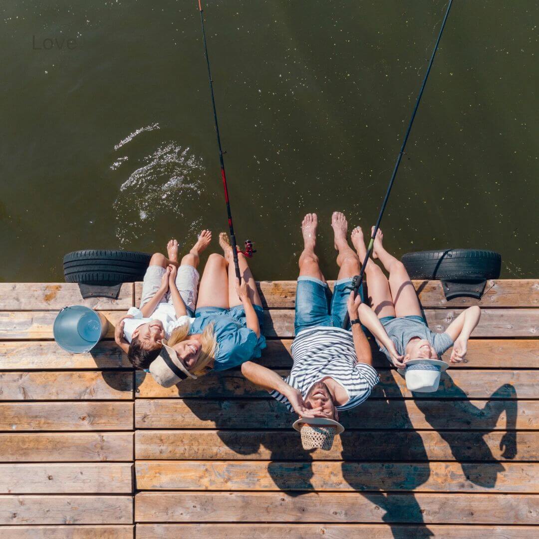 Family fishing off the pier at a wedding venue in Corsicana Texas. Texas Family fishing off the pier at the East Texas wedding venue near Dallas.