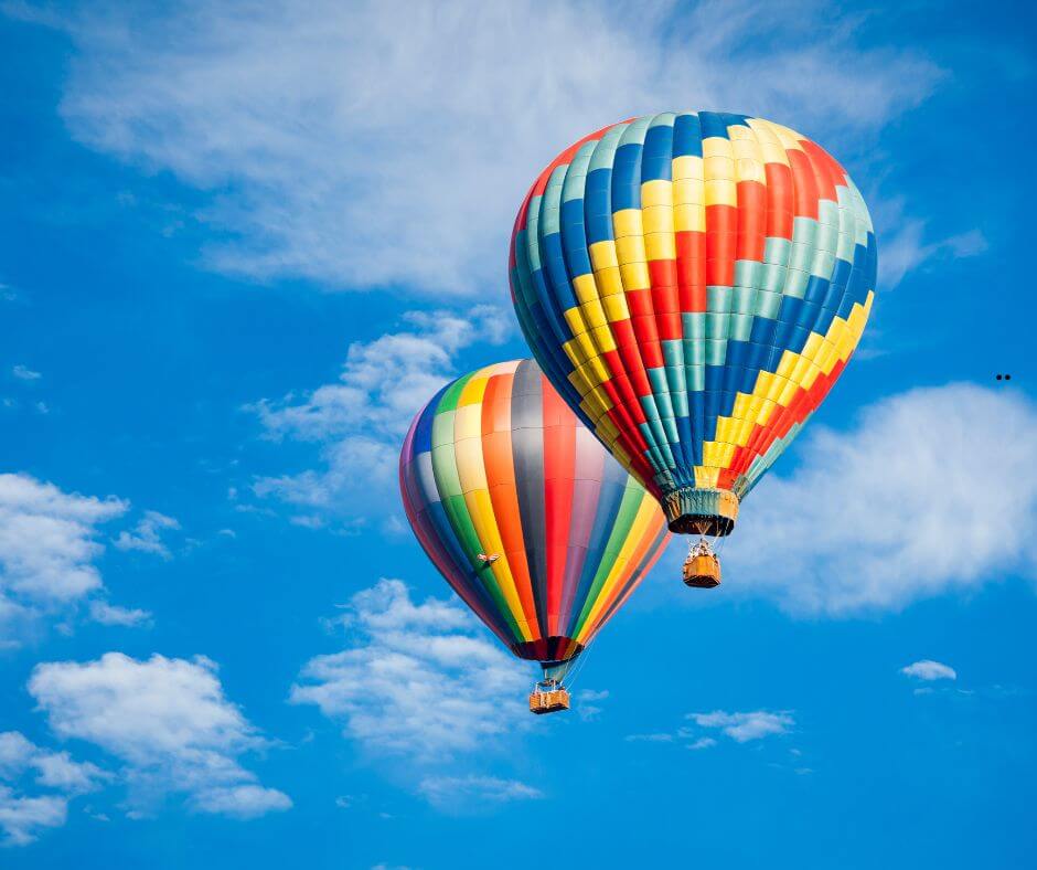 Colorful hot air balloons lifting off at the Great Texas Balloon Race in Longview, East Texas, July 2025