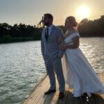 couple renewing vows at lakefront wedding venue in Texas at sun