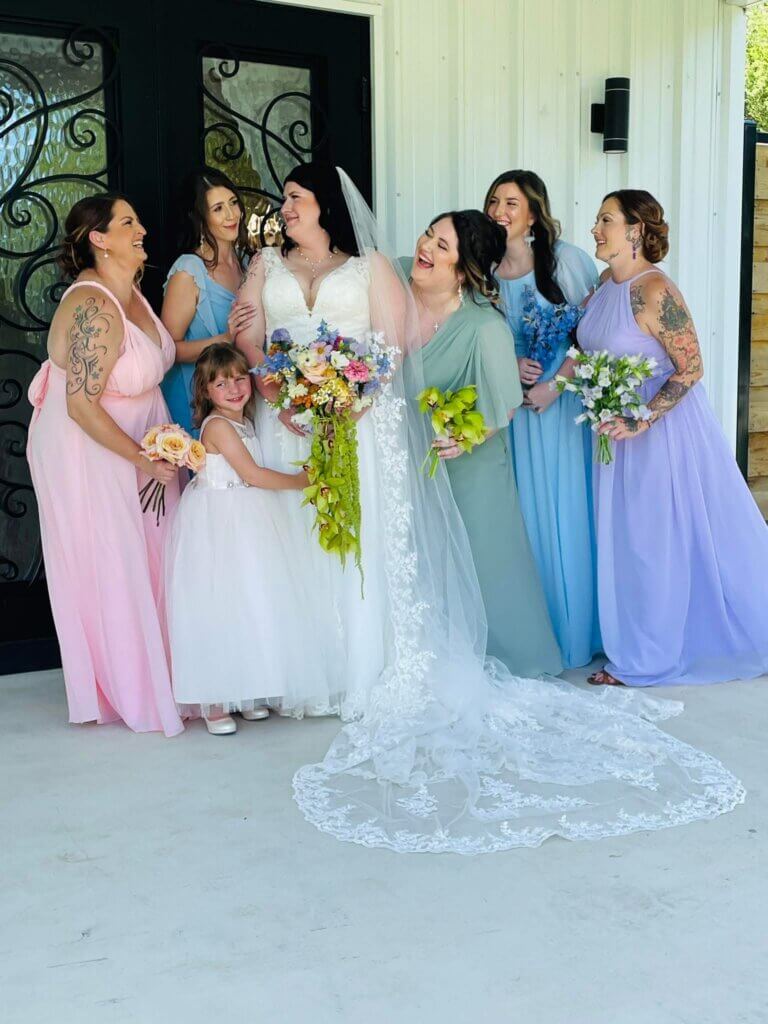 Bridal party enjoying lakeside wedding in Corsicana, Texas with affordable venue package