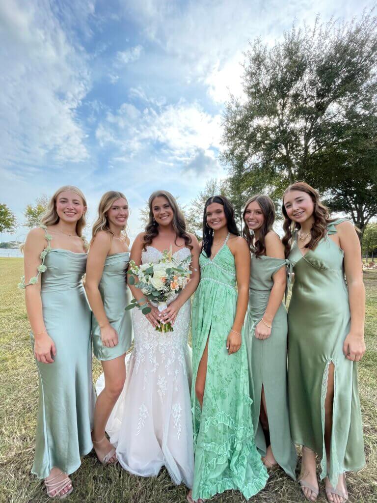 Guests enjoying lakeside scenery at Lakefront Acres during a wedding or event.