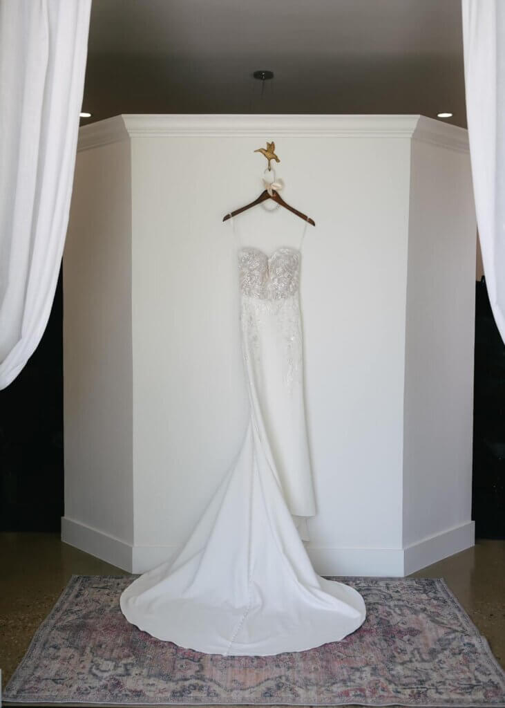 Bride smiling while getting ready inside the private bridal suite at Lakefront Acres wedding venue, just a short drive from Fairfield, Texas.