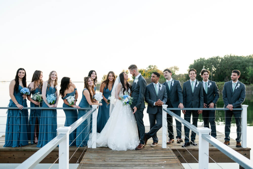 Bride and groom posing for trendy social media wedding photos at a luxury lakeside Texas wedding venue
