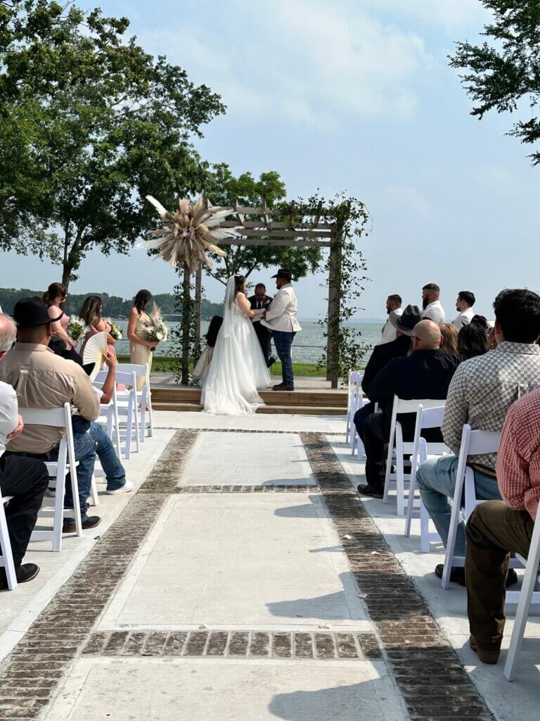 Outdoor Christian wedding ceremony near Dallas at Lakefront Acres