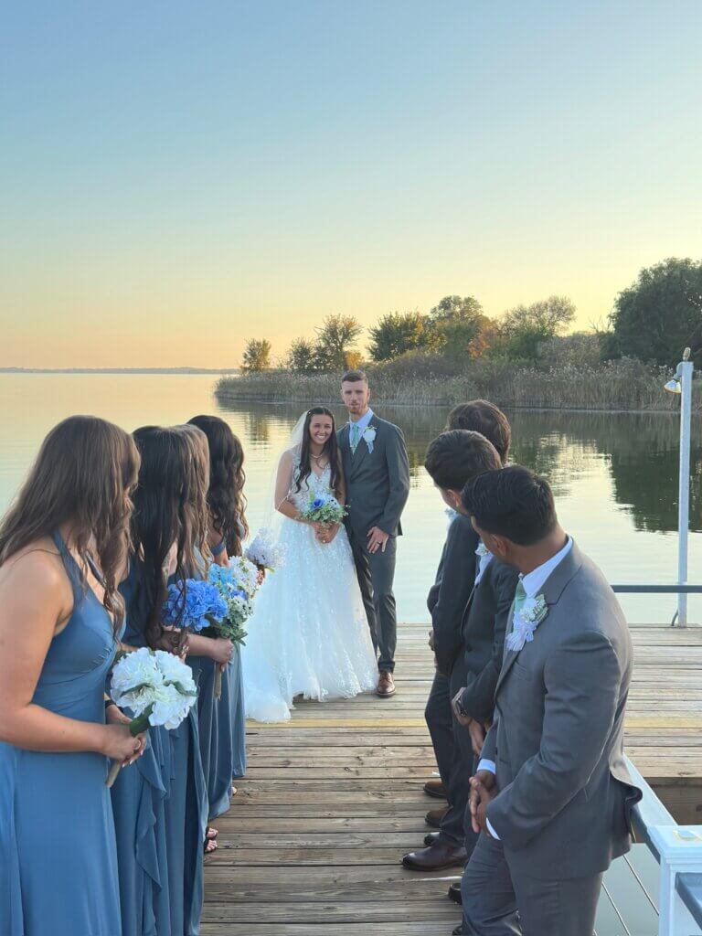 Bride and groom portrait at sunset at Lakefront Acres, a fairytale wedding venue near Dallas with water views.