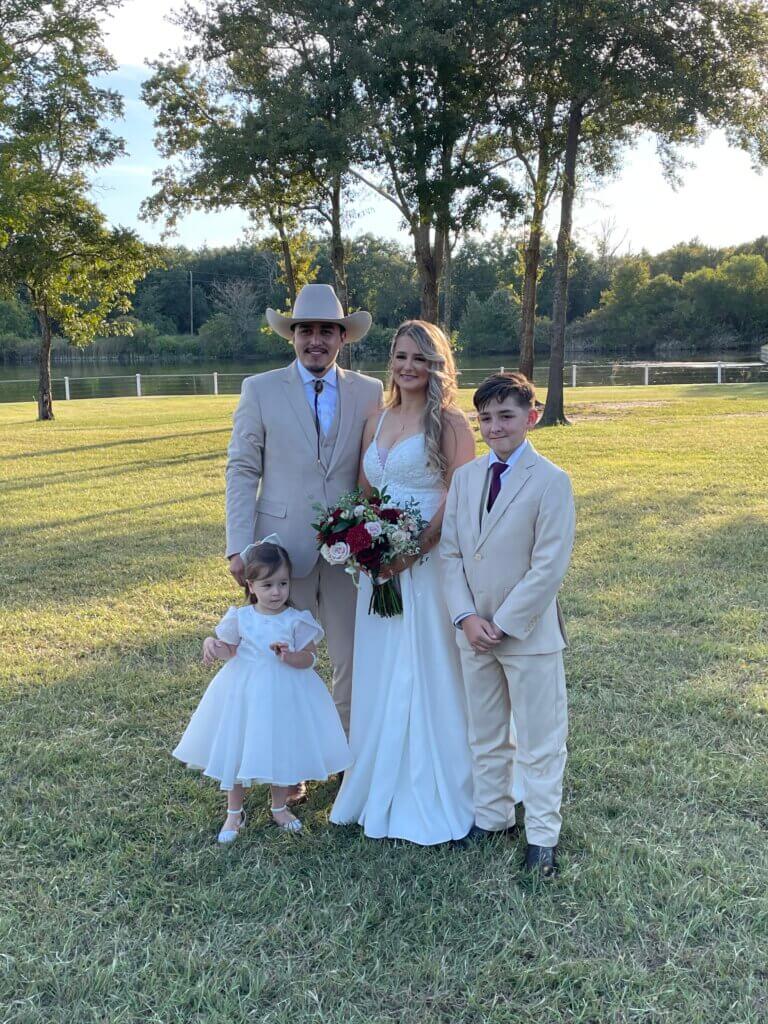 couple renewing vows surrounded by family and loved ones