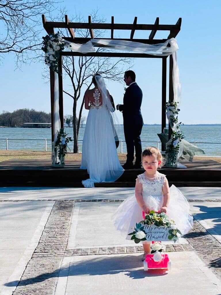 children participating in vow renewal ceremony walking parents down aisle