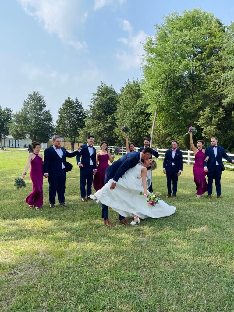 Bride and groom celebrating at a lakeside wedding venue in East Texas