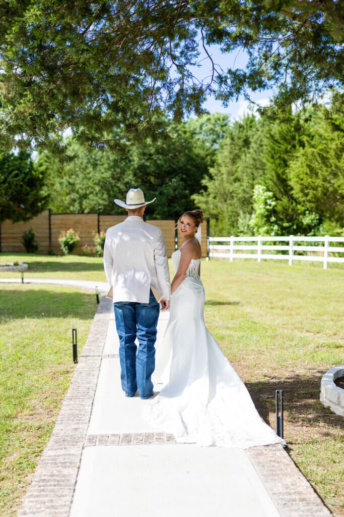 Bride walking down the aisle during an outdoor North Texas wedding