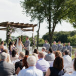 Lakeside wedding ceremony at Lakefront Acres in Kerens Texas